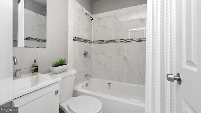 full bathroom with shower / tub combo with curtain, vanity, and toilet