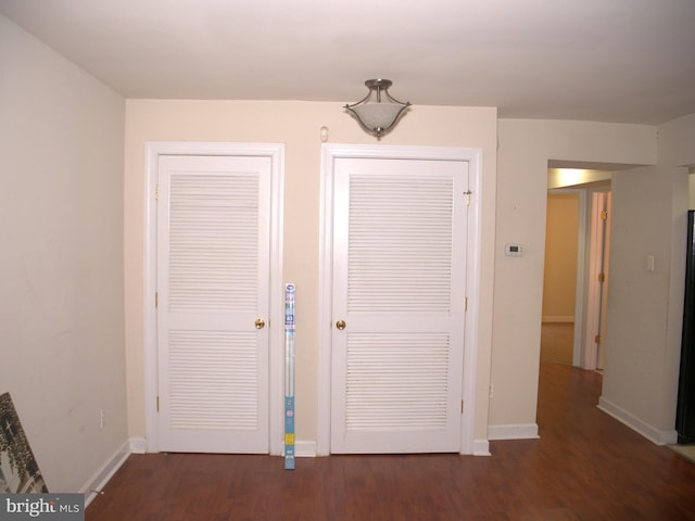 foyer entrance with dark wood-type flooring