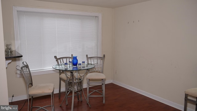 dining area featuring dark hardwood / wood-style flooring