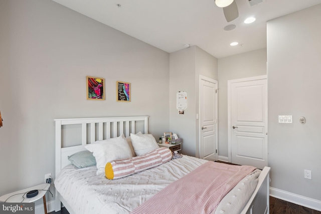 bedroom with ceiling fan and dark hardwood / wood-style flooring