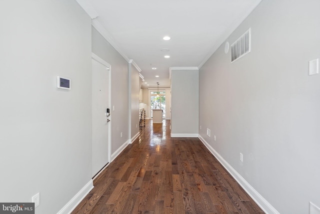 corridor featuring ornamental molding, dark wood-type flooring, and french doors