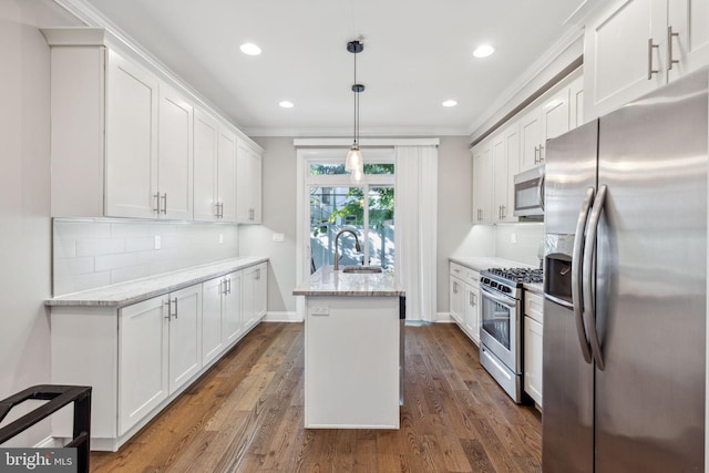 kitchen featuring white cabinets, a kitchen island, dark wood-type flooring, and appliances with stainless steel finishes