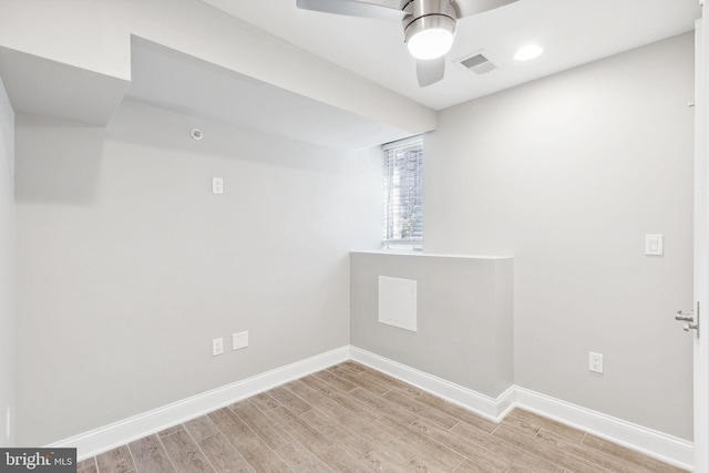 unfurnished room with ceiling fan and light hardwood / wood-style floors