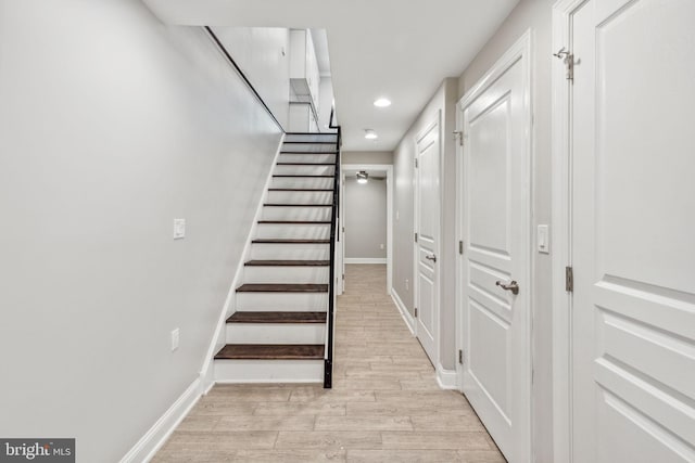 stairway featuring wood-type flooring