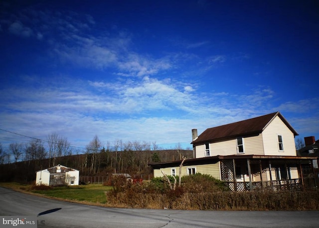 view of property exterior with a porch