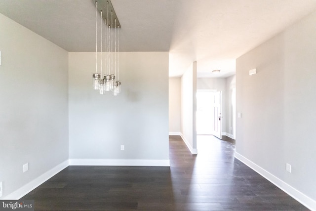 unfurnished dining area featuring dark hardwood / wood-style flooring