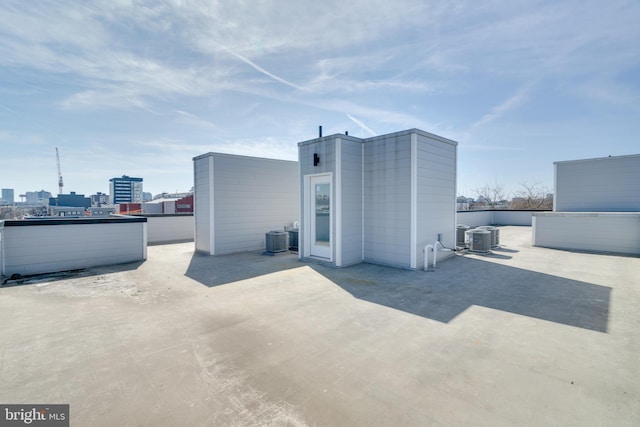 back of house with central air condition unit and a patio area