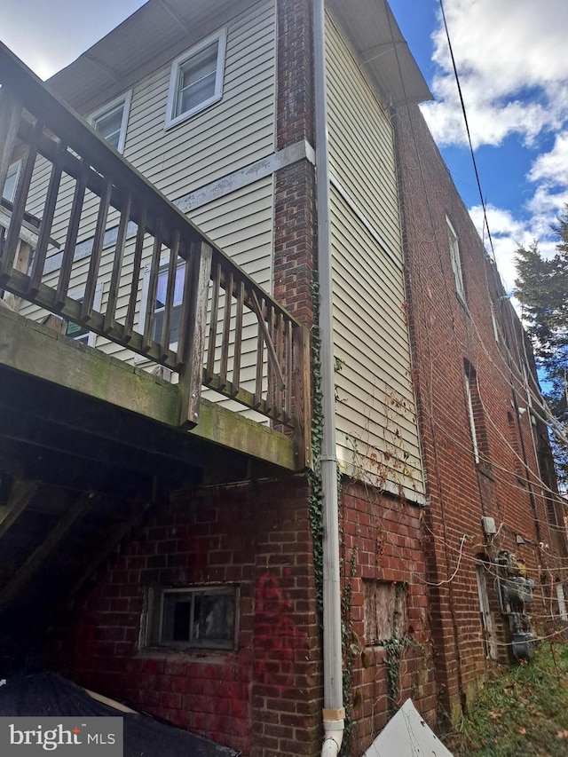 view of home's exterior with a balcony