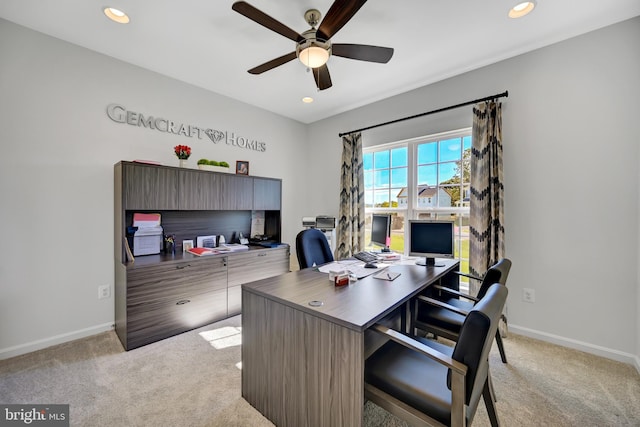 carpeted home office with ceiling fan