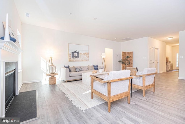 living room with light hardwood / wood-style floors