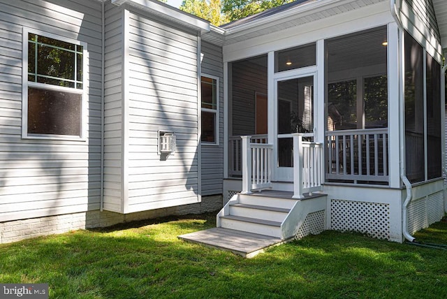 property entrance featuring a yard