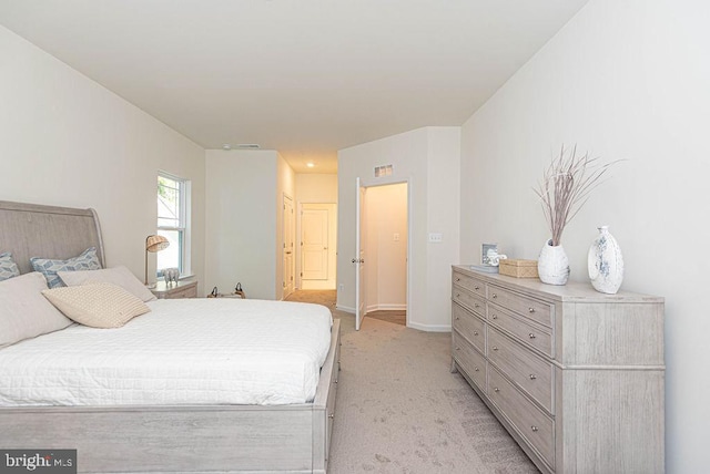 bedroom with light colored carpet