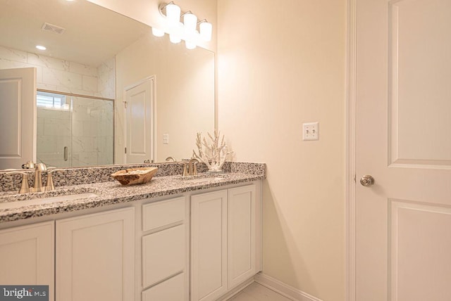 bathroom featuring vanity and an enclosed shower