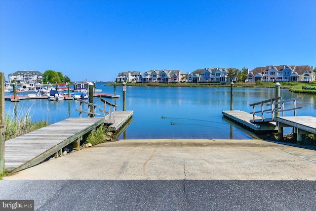 dock area with a water view