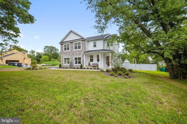 view of front of house with a front lawn and a porch