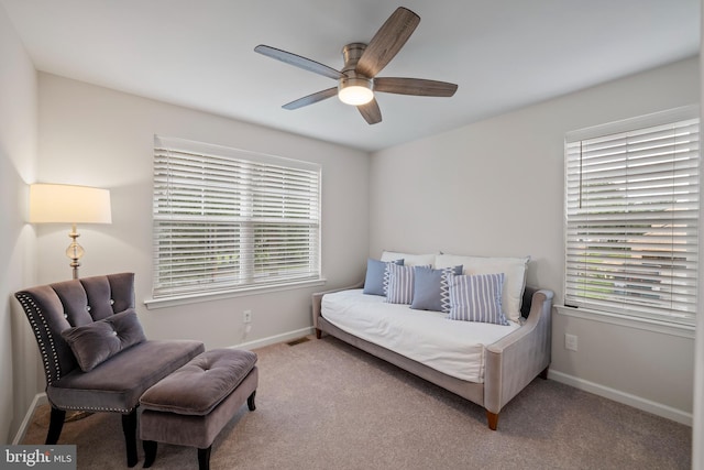 bedroom featuring ceiling fan and light carpet