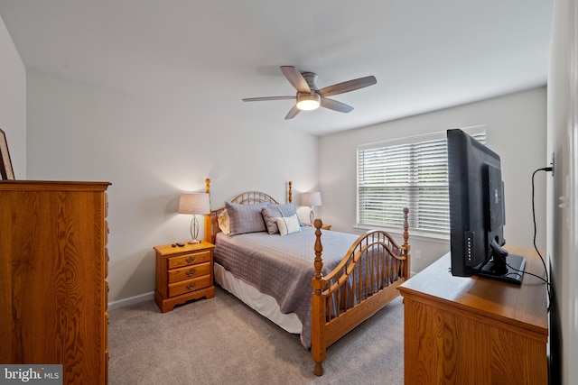 bedroom with light colored carpet and ceiling fan