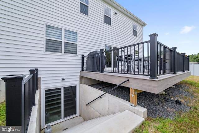 back of property featuring a wooden deck