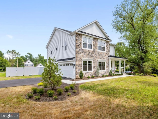 view of front facade with a garage and a front lawn