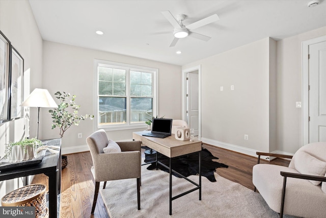 office with ceiling fan and hardwood / wood-style flooring