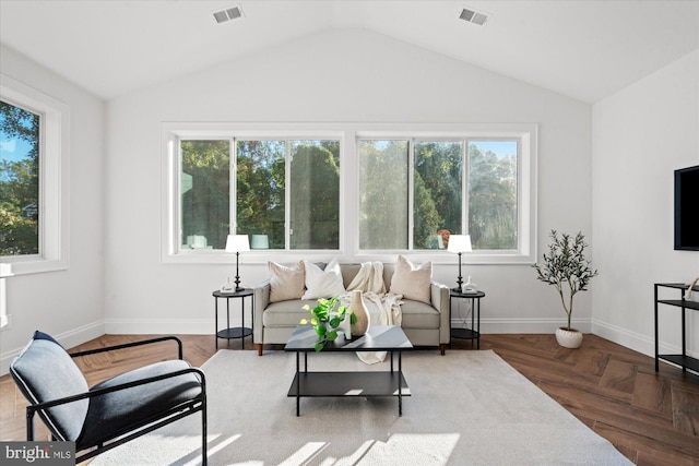 living room with parquet floors and lofted ceiling