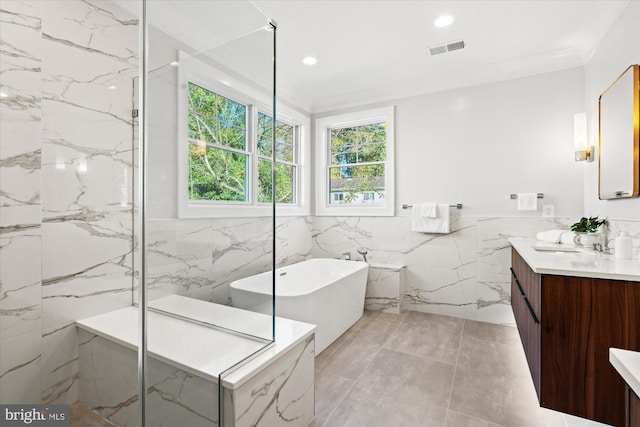 bathroom featuring vanity, separate shower and tub, tile walls, and crown molding