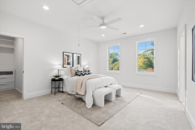 bedroom featuring ceiling fan and light carpet