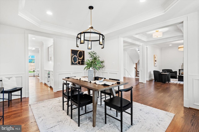 living room with light hardwood / wood-style floors and crown molding