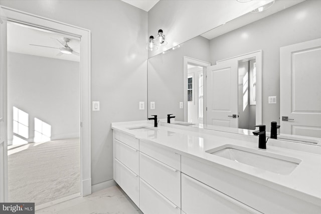 bathroom with ceiling fan and vanity