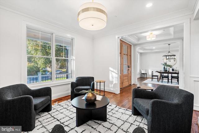 kitchen featuring a center island, light hardwood / wood-style floors, white cabinetry, and hanging light fixtures