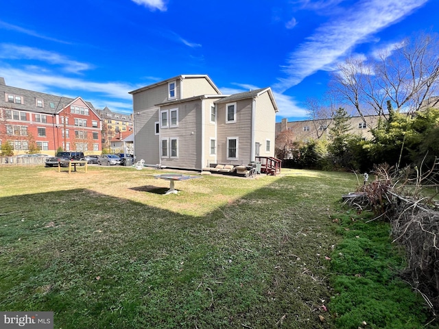 back of house featuring a yard