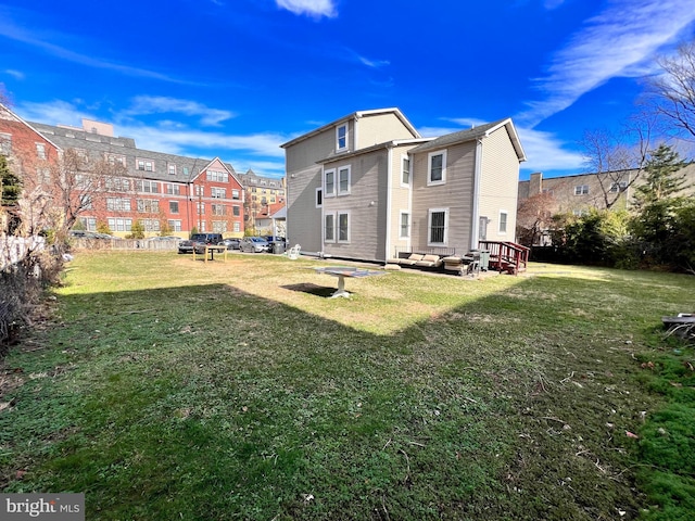 rear view of property with a yard and an outdoor hangout area