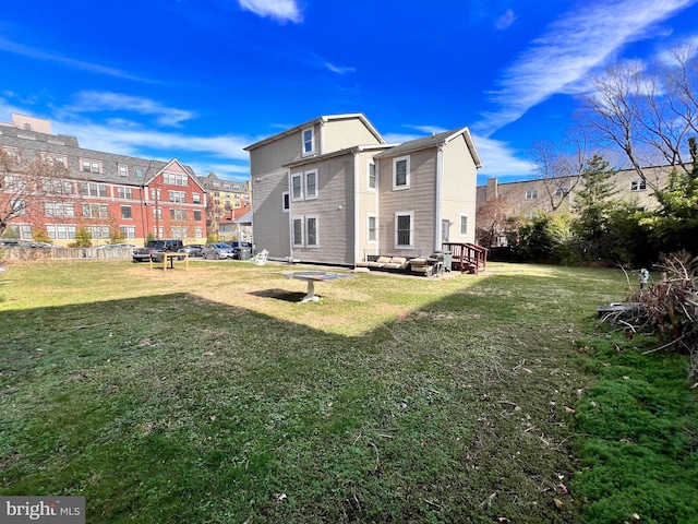 back of house featuring a yard