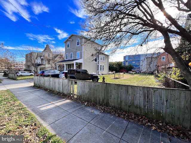 view of home's exterior with a lawn