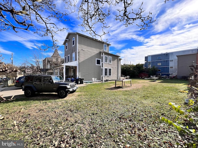 view of side of home featuring a lawn