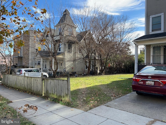 view of property exterior featuring a lawn