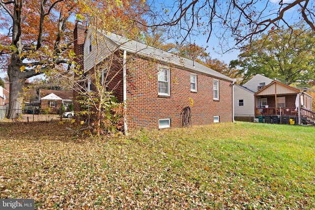 view of property exterior featuring a lawn