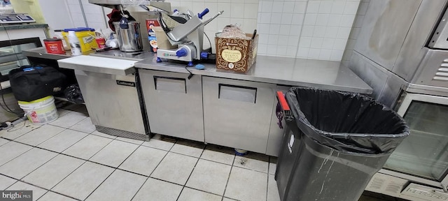 kitchen with light tile patterned floors