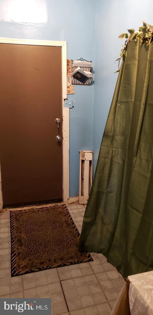 entryway featuring light tile patterned flooring