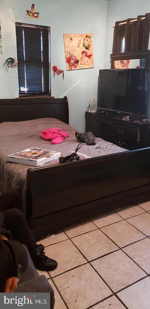 bedroom featuring tile patterned floors