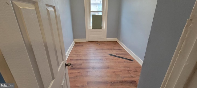 corridor featuring hardwood / wood-style floors