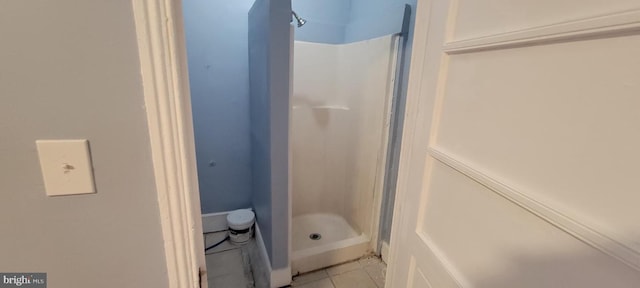 bathroom featuring tile patterned flooring and walk in shower