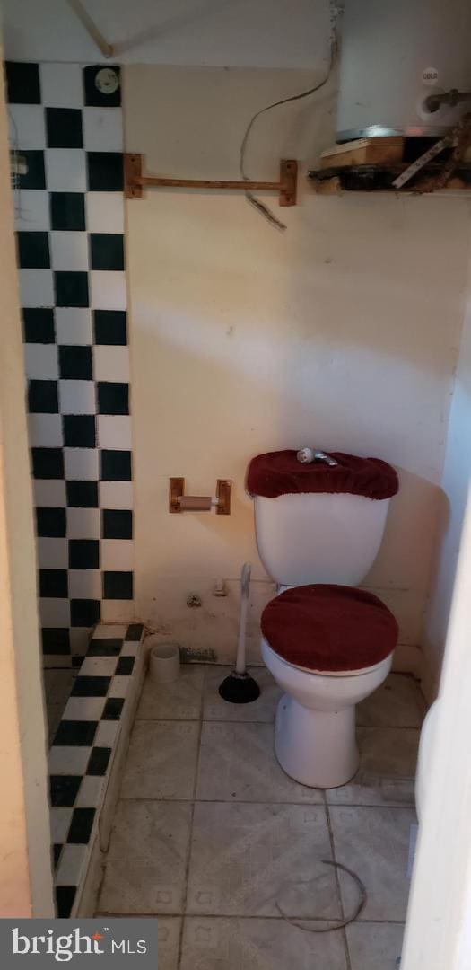 bathroom with tile patterned floors and toilet