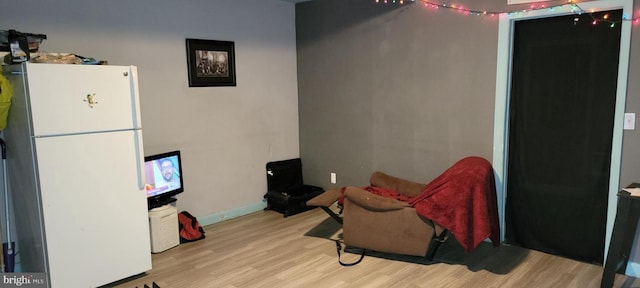 sitting room with light wood-type flooring