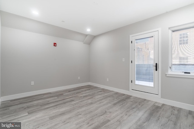 unfurnished room featuring light hardwood / wood-style floors