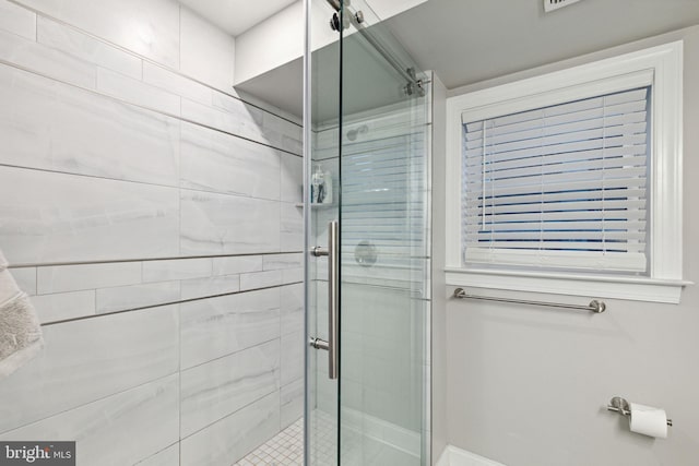 bathroom with an enclosed shower