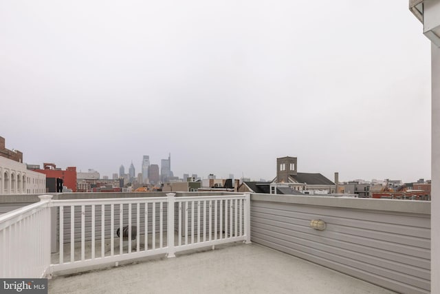 view of patio featuring a balcony