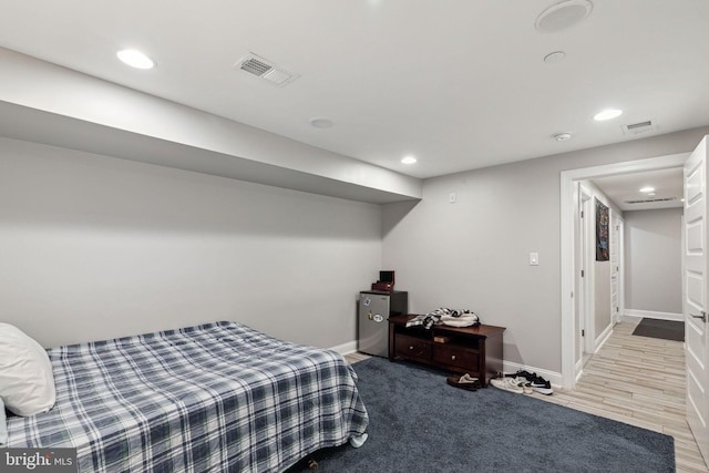 bedroom featuring light wood-type flooring