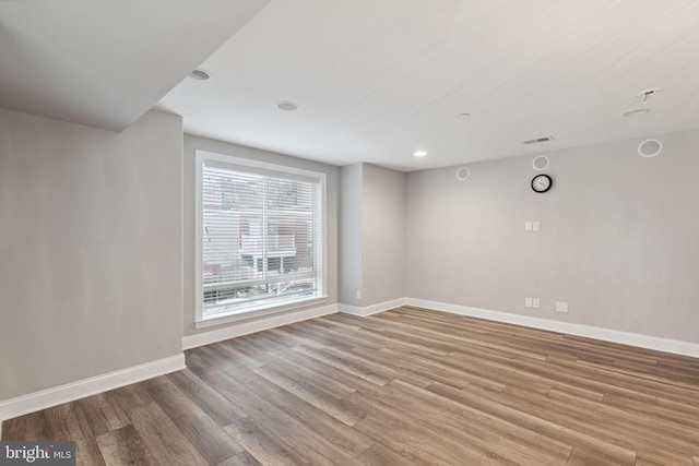 spare room with light hardwood / wood-style flooring