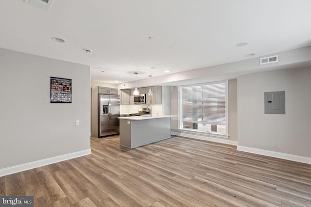 interior space with electric panel and light wood-type flooring